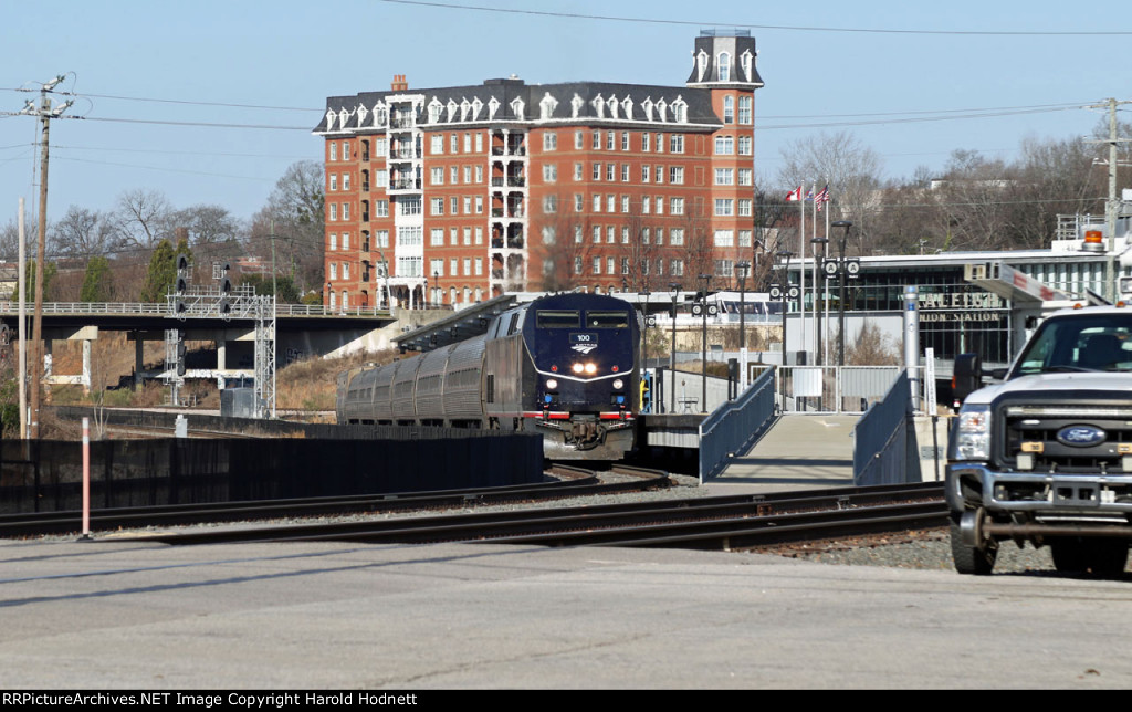 AMTK 100 leads train P080-14 away from RUS